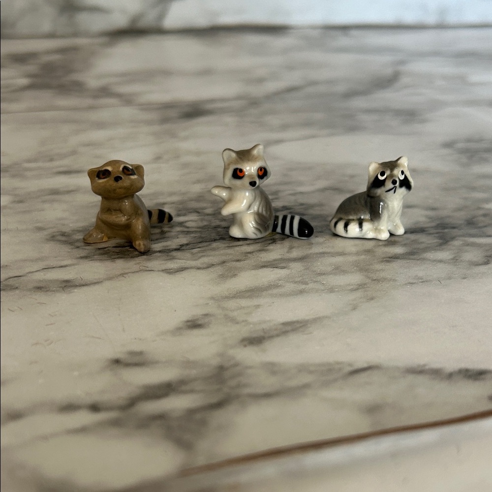 Set 3 raccoon figurines trinkets, 1 marked Bug house Japan, 1 Bug House Taiwan